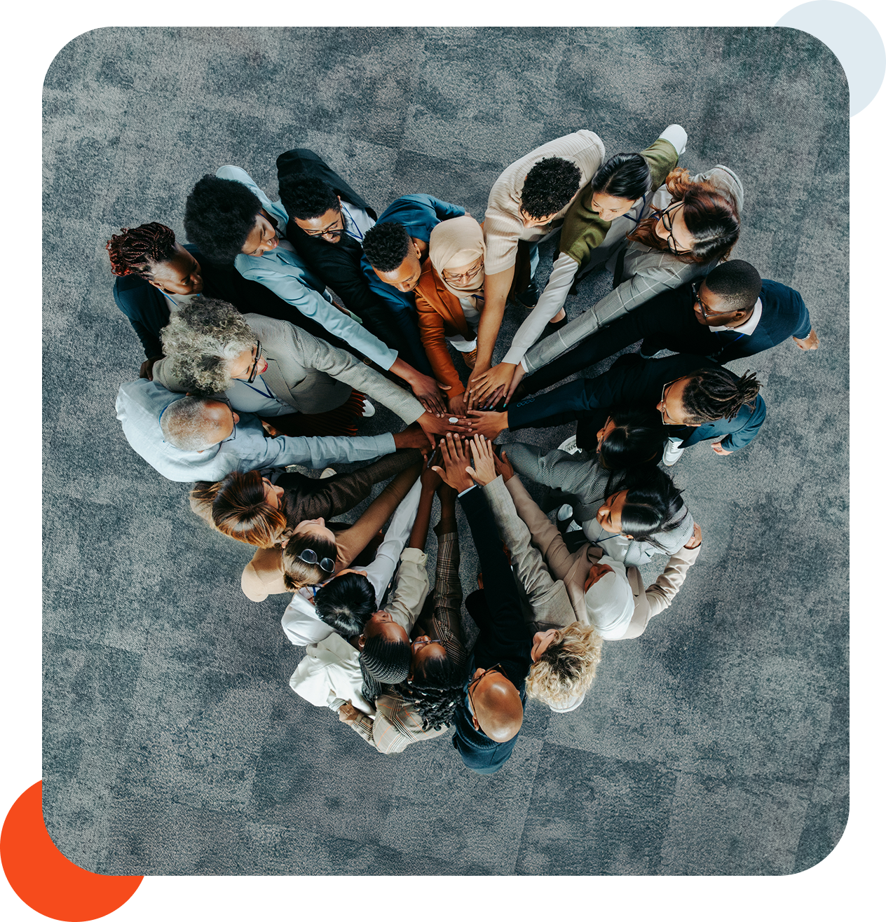 Group of people forming a united circle.