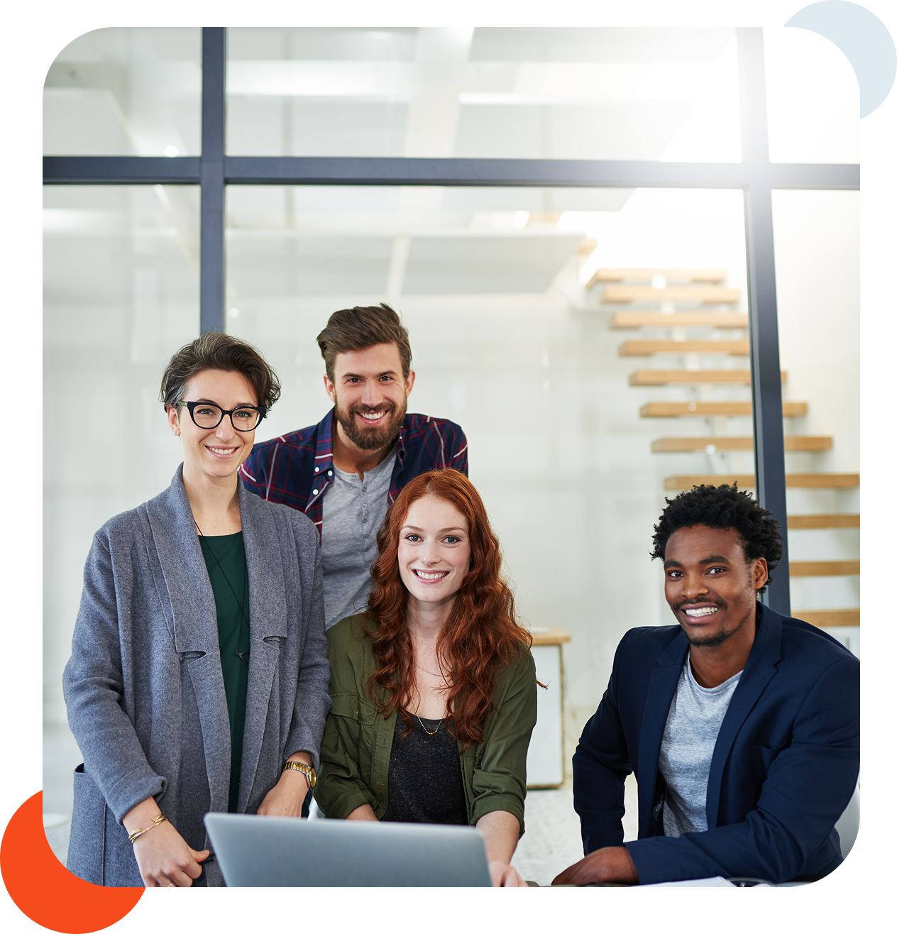 Diverse group of professionals posing together.